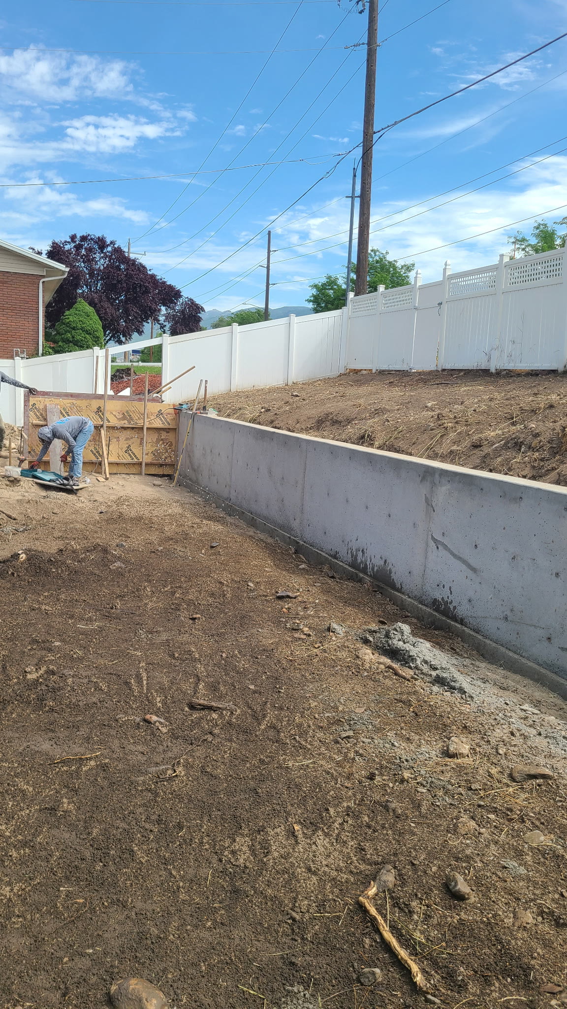 Retaining wall and site preparation by the crew